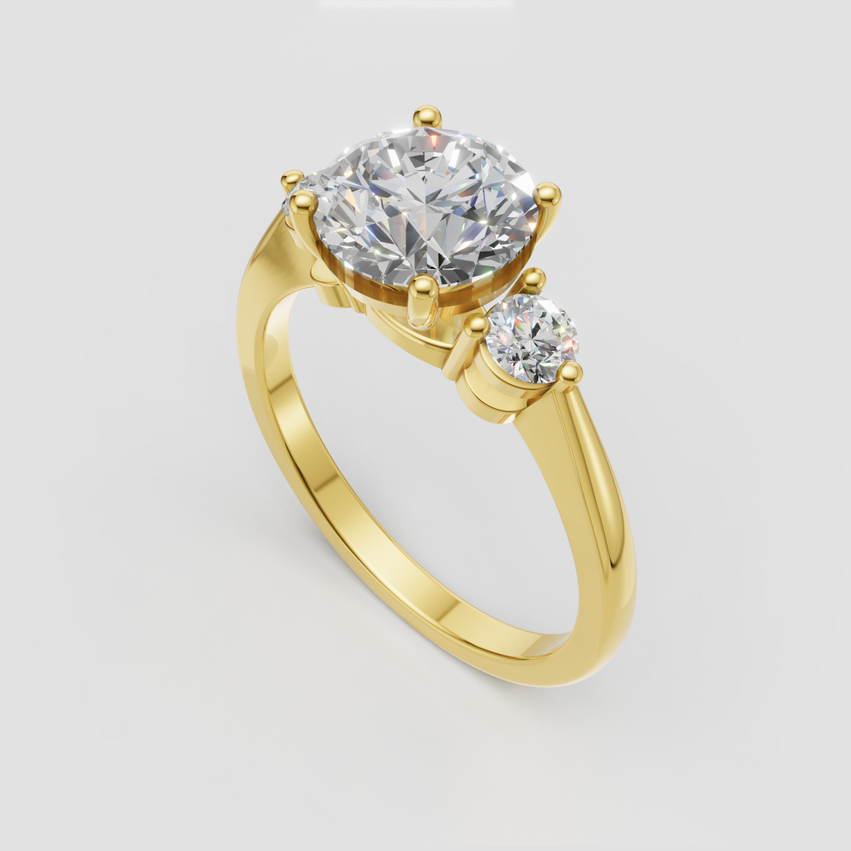 Three-stone round Diamond ring in polished yellow gold