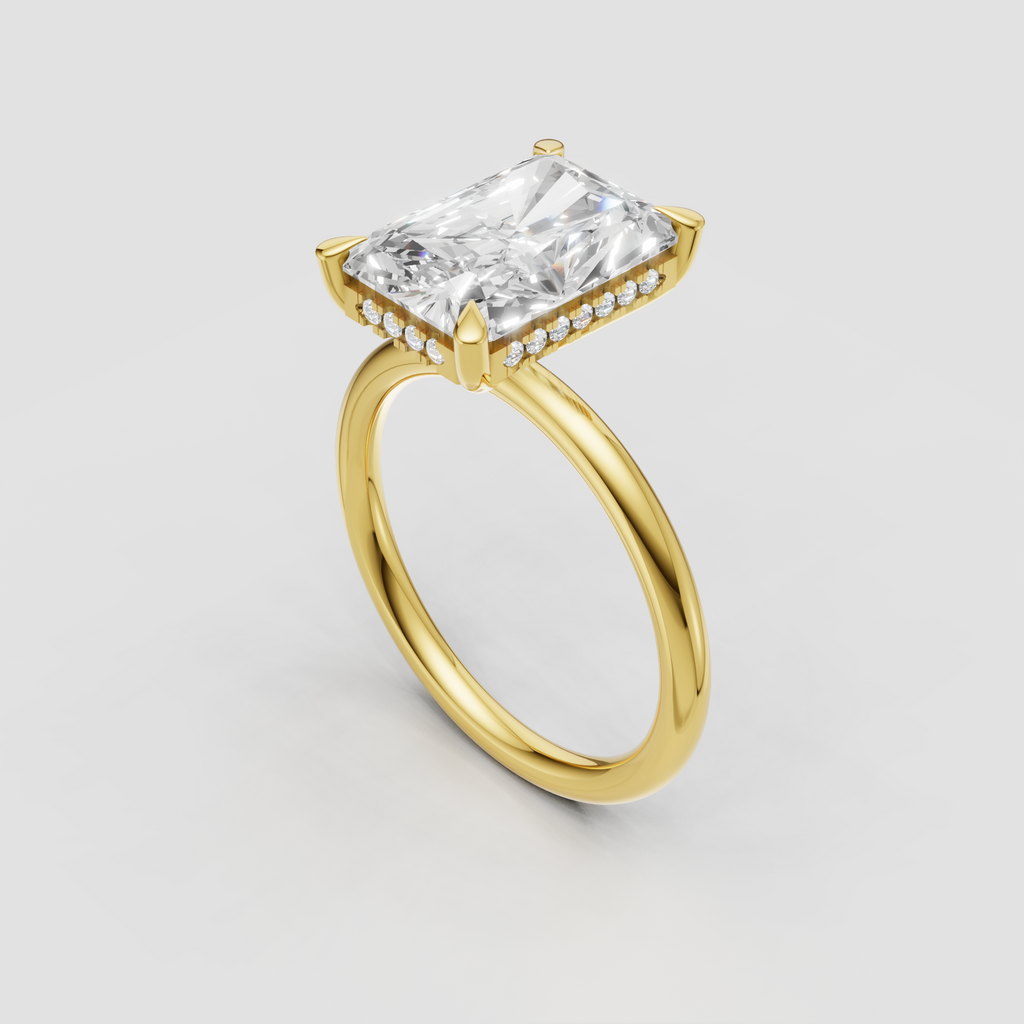 Radiant cut diamond solitaire ring in polished yellow gold