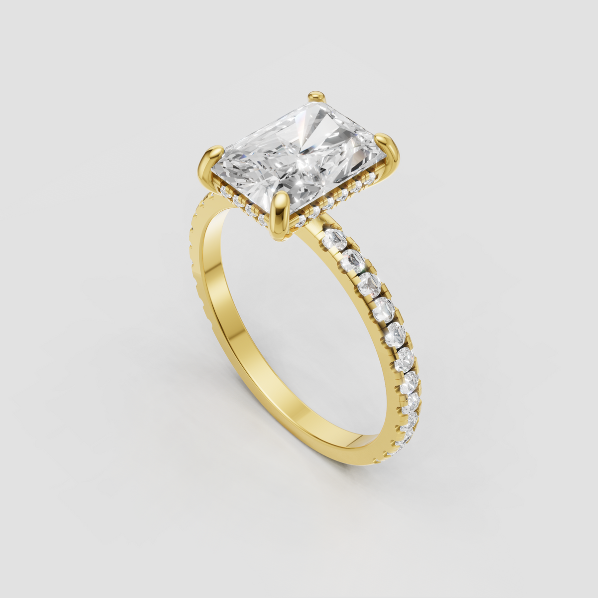 Elongated radiant diamond engagement ring with four-prong setting