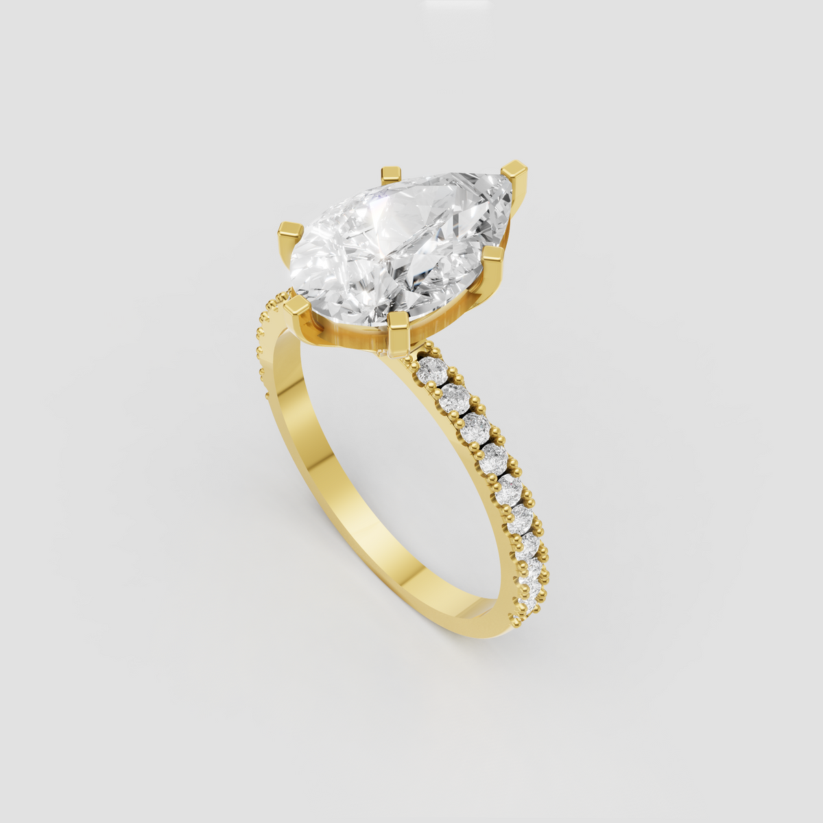 Pear diamond prong engagement ring with pavé diamond band