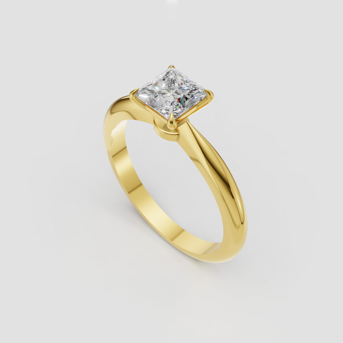 Princess cut diamond ring with four-prong setting and yellow gold band