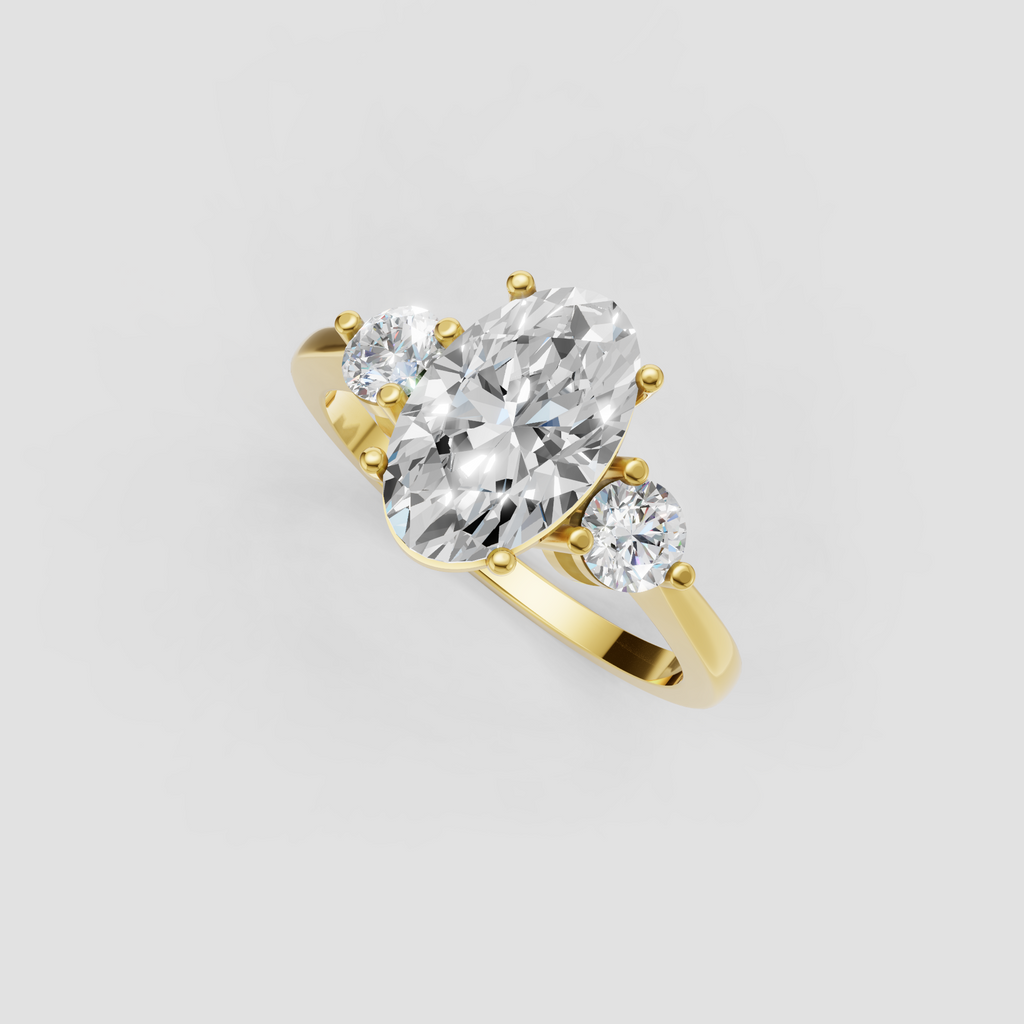 Oval diamond three stone engagement ring in polished gold
