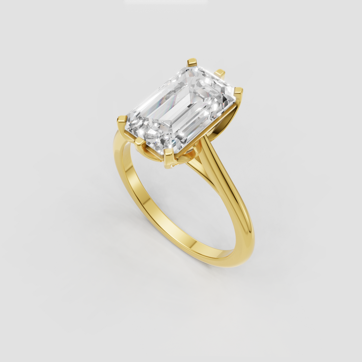 Emerald cut engagement ring with sculptural twisted shoulders