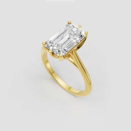 Emerald cut engagement ring with sculptural twisted shoulders