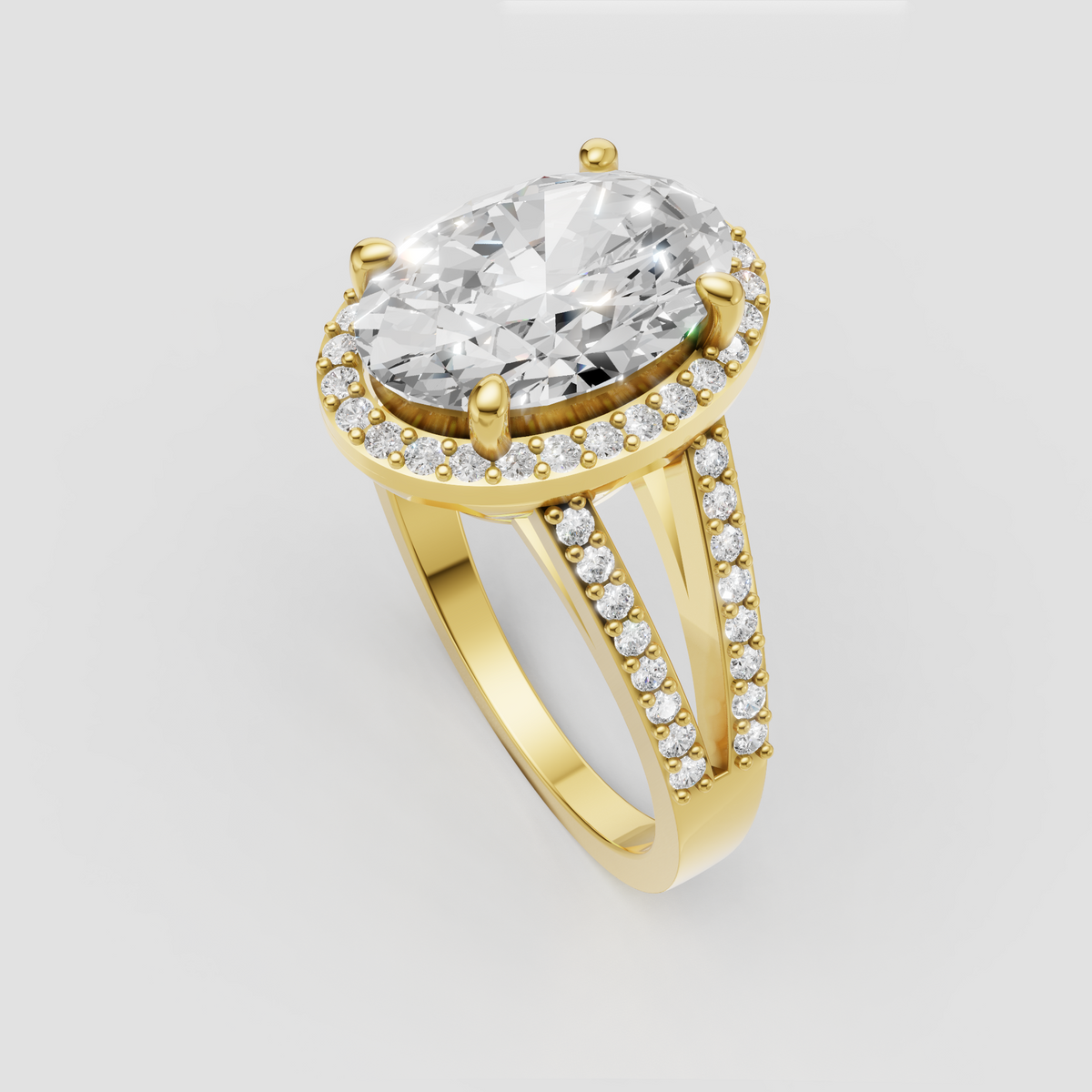 Yellow gold oval diamond ring with sparkling halo and pavé band.