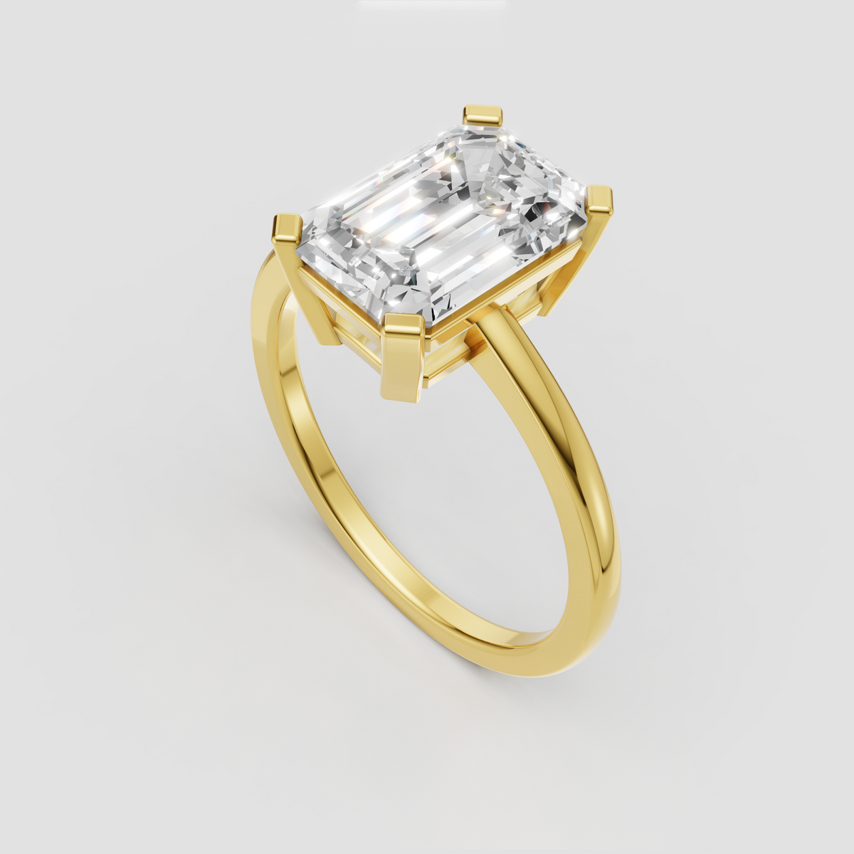 Emerald cut yellow gold engagement ring