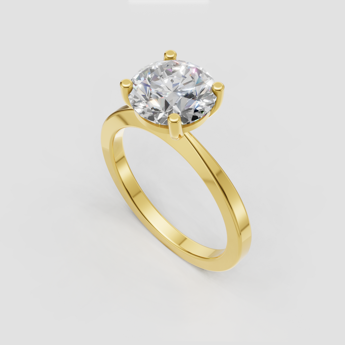 Round cut diamond solitaire engagement ring with four prongs