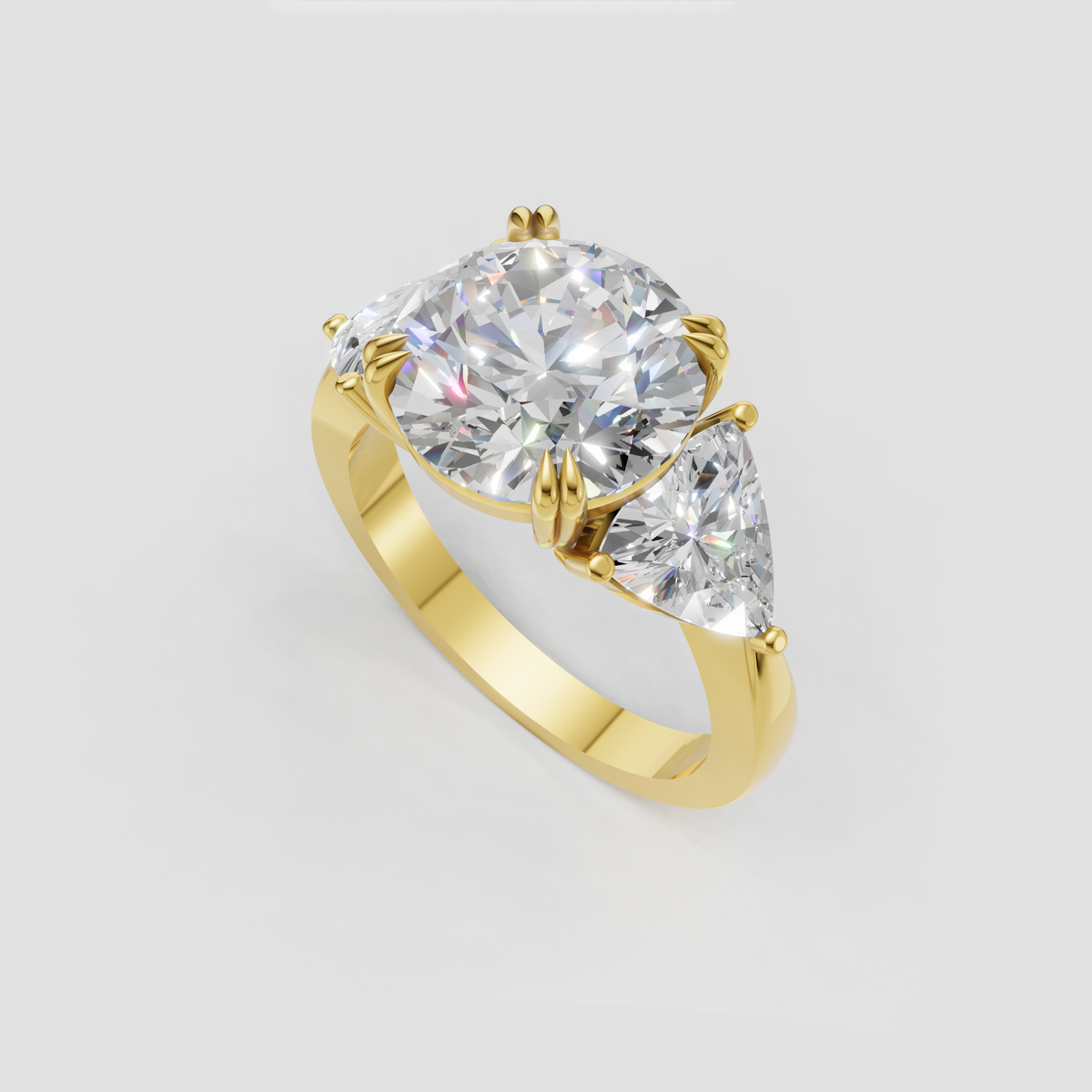 Round diamond three stone ring with pear accent diamonds and sculpted prong setting