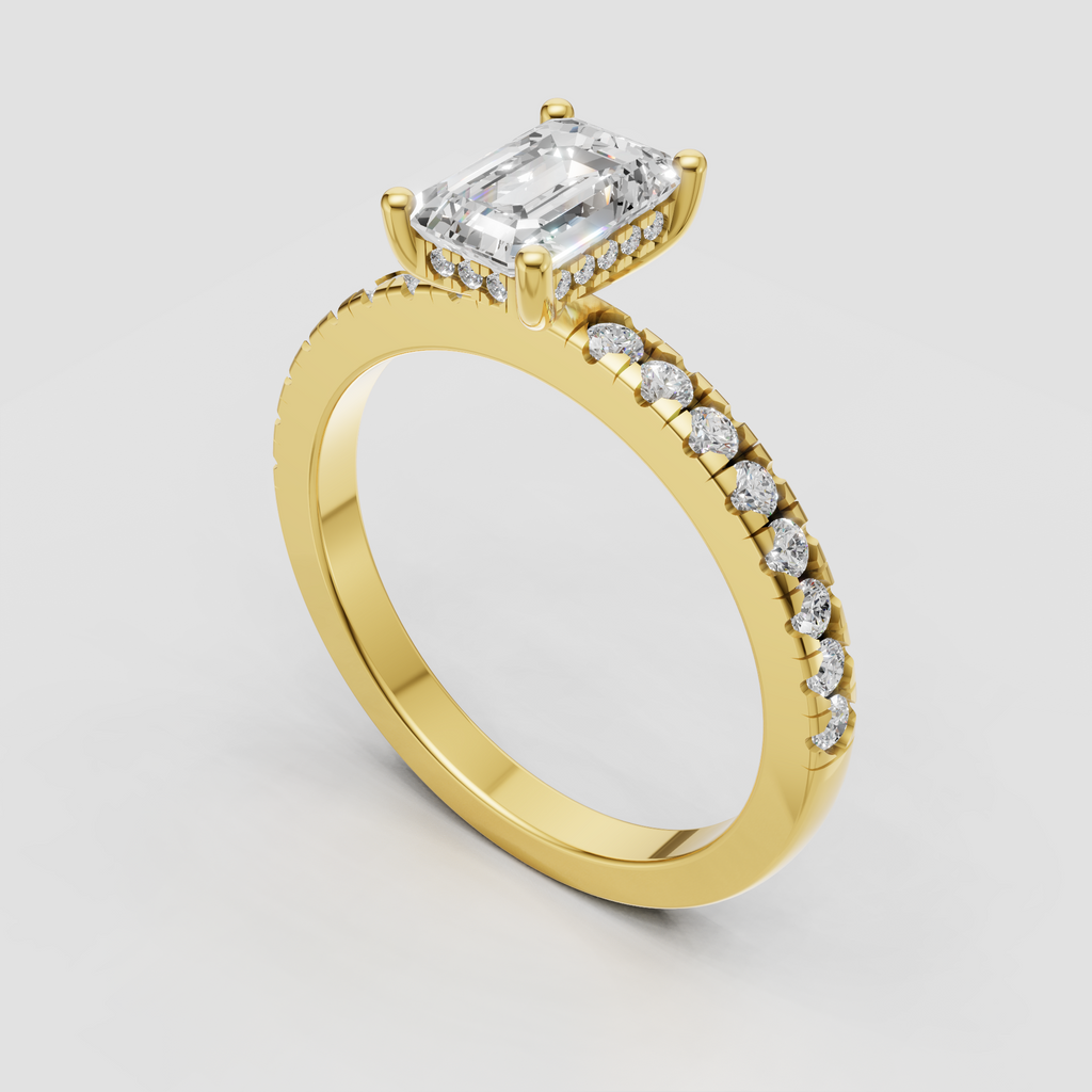 Emerald cut diamond ring in polished yellow gold with round side stones
