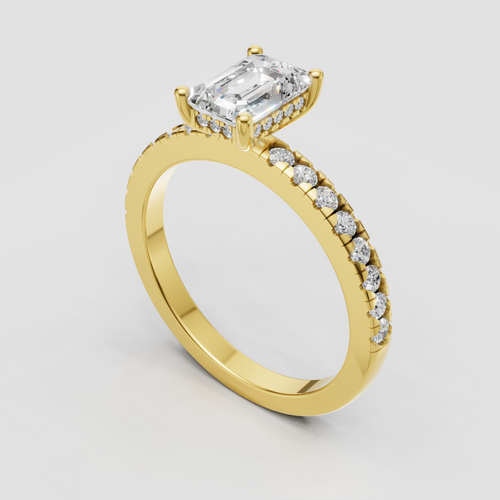 Emerald cut diamond ring in polished yellow gold with round side stones