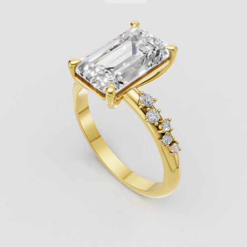 Emerald cut diamond engagement ring with pavé shoulders