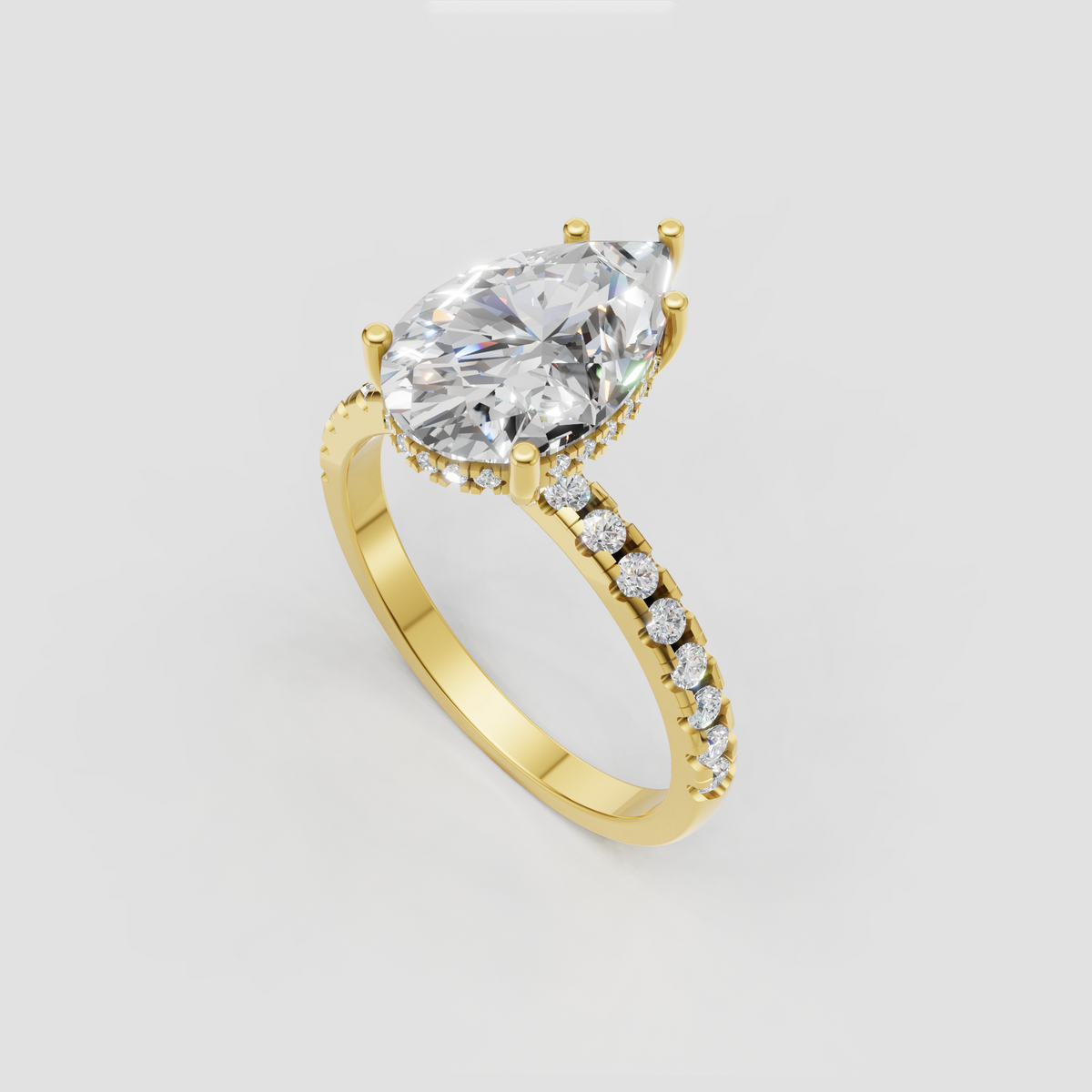 Pear Diamond solitaire engagement ring with four rounded prongs and pavé band