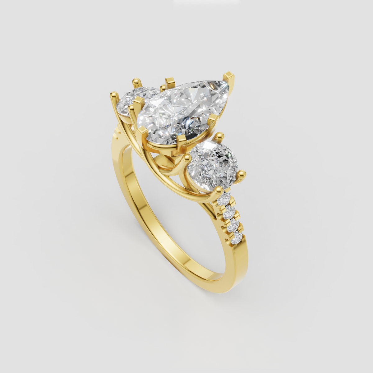 Pear shaped center diamond engagement ring in polished yellow gold