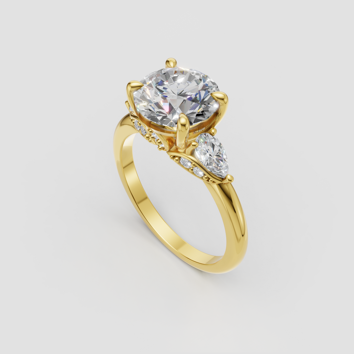 Round diamond engagement ring with pear-shaped side stones