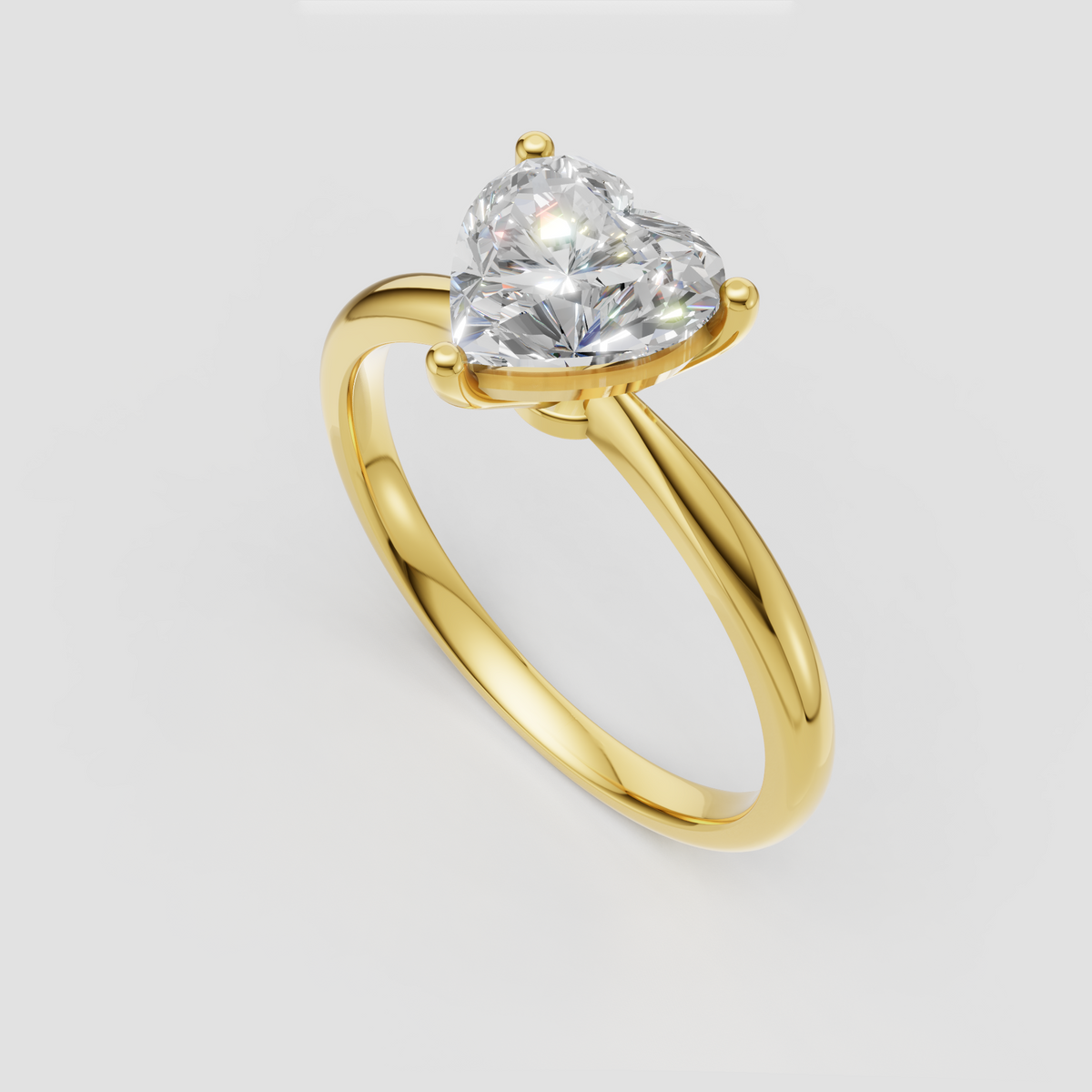 Heart shaped diamond engagement ring in classic three prong solitaire setting
