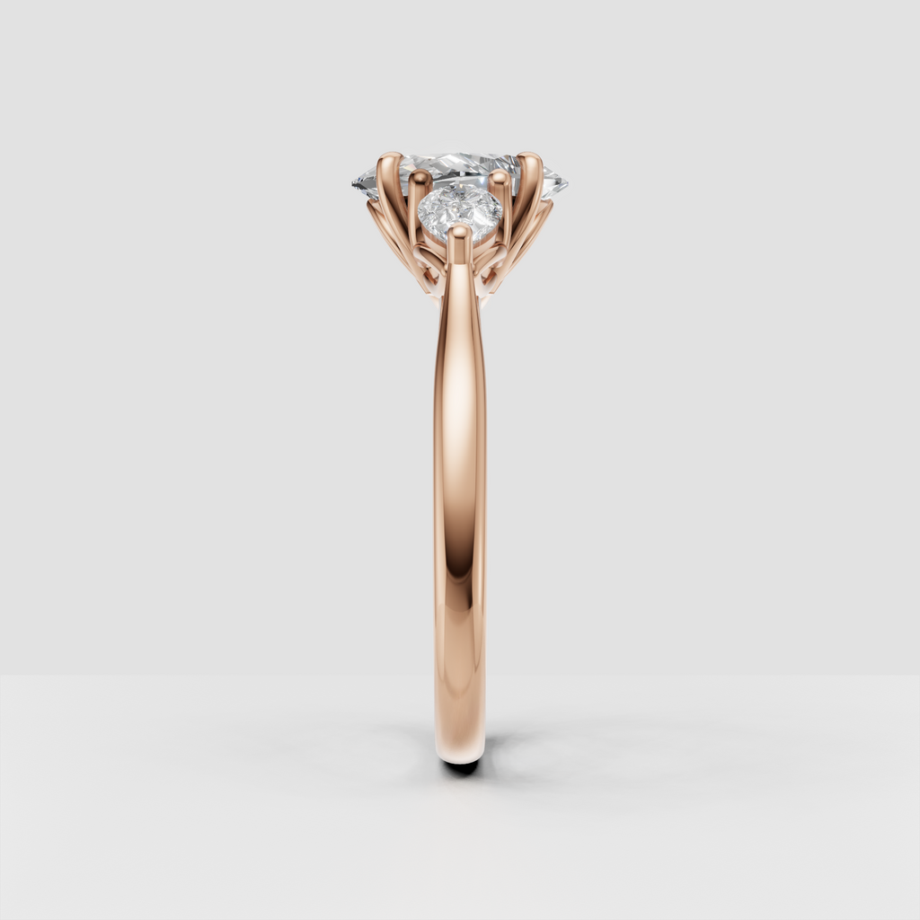 Yellow gold three-stone engagement ring with oval center diamond