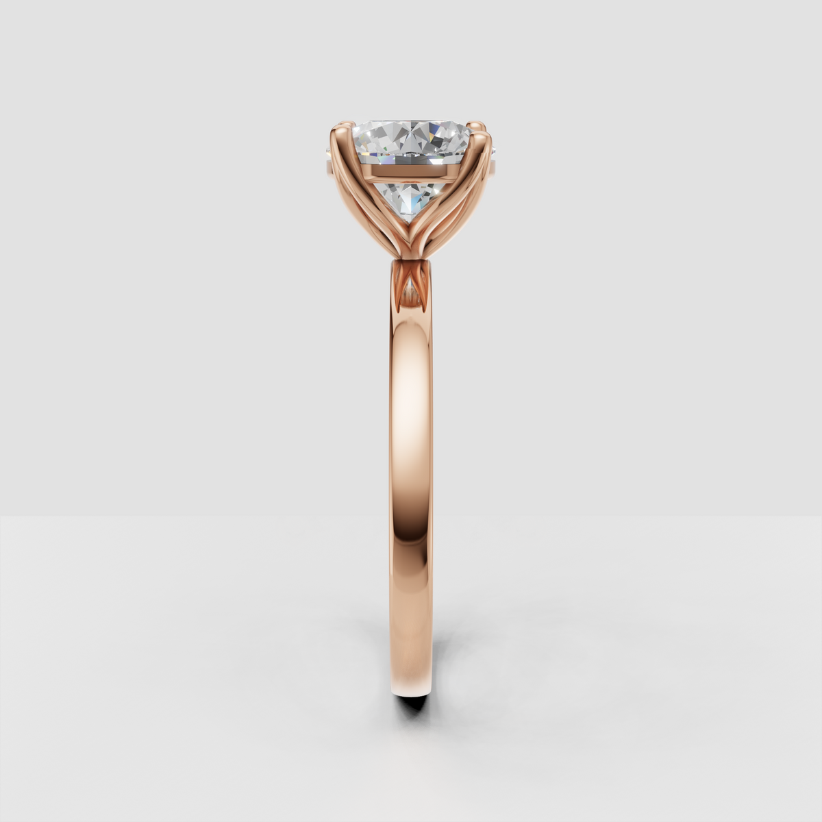 Round cut diamond ring with graceful curved cathedral shoulders