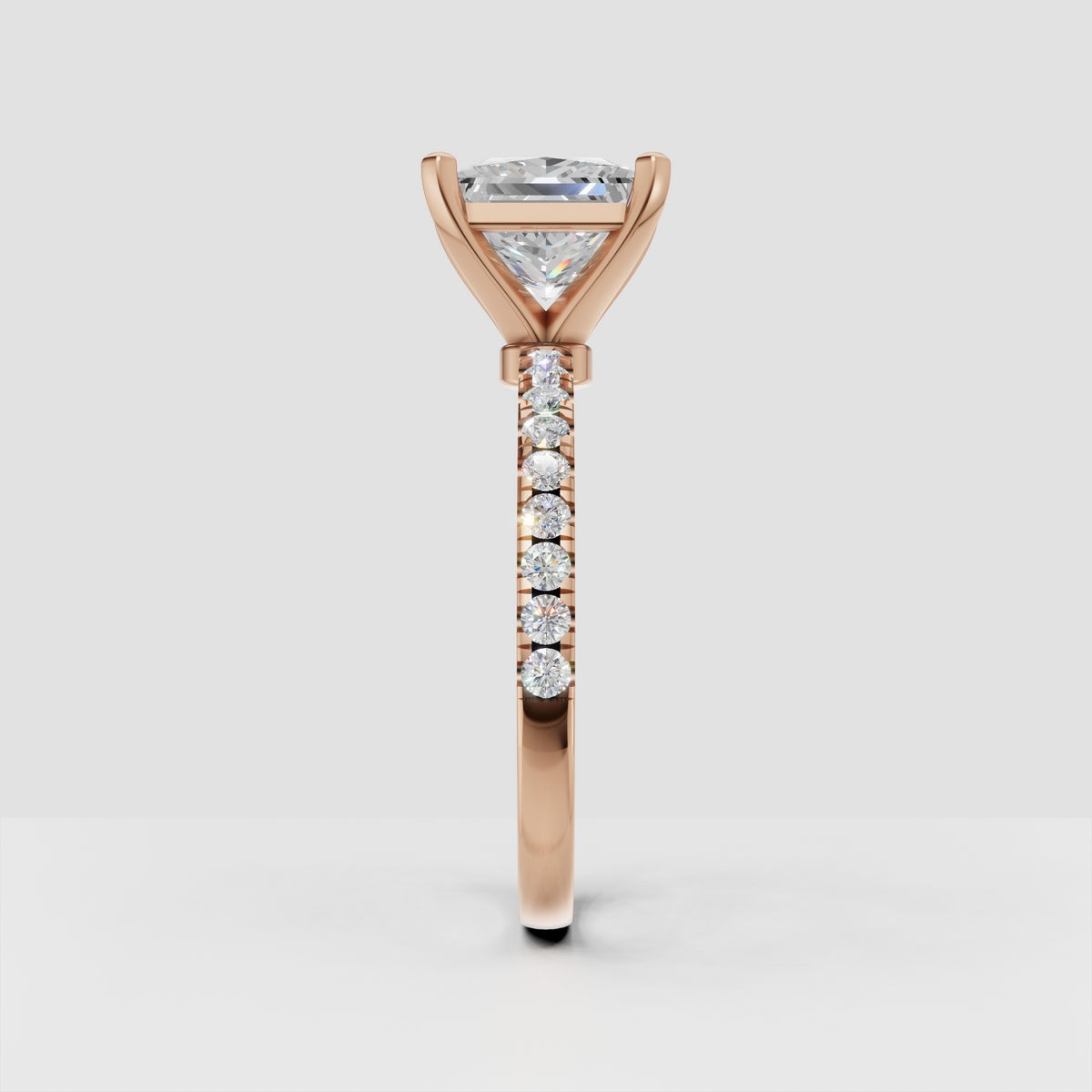 Modern princess cut diamond solitaire with polished gold band