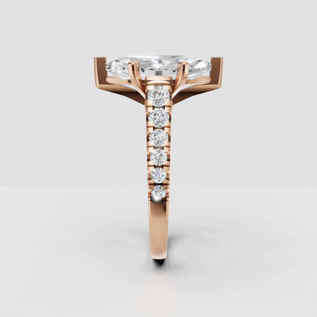 Side view of marquise cut diamond engagement ring showing elevated cathedral setting