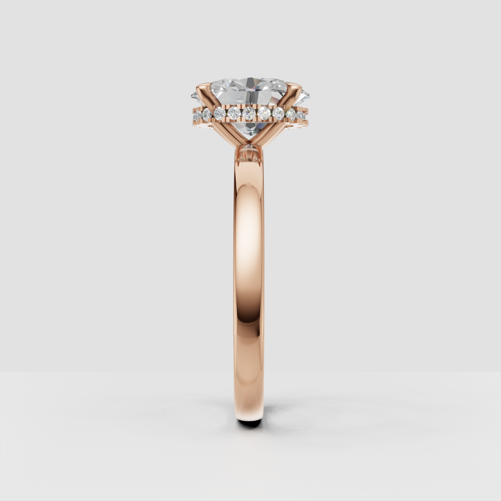 Side view of oval diamond engagement ring showing concealed halo