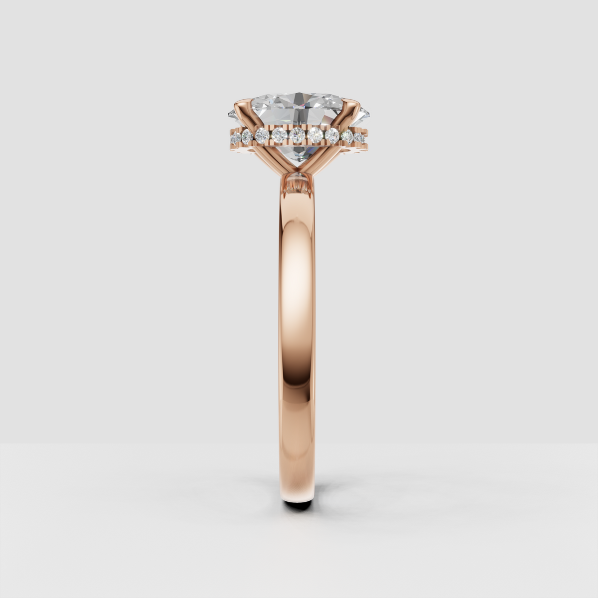 Side view of oval diamond engagement ring showing concealed halo
