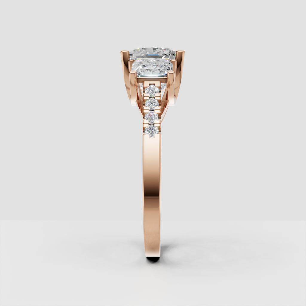 Yellow gold engagement ring with princess cut diamond trio