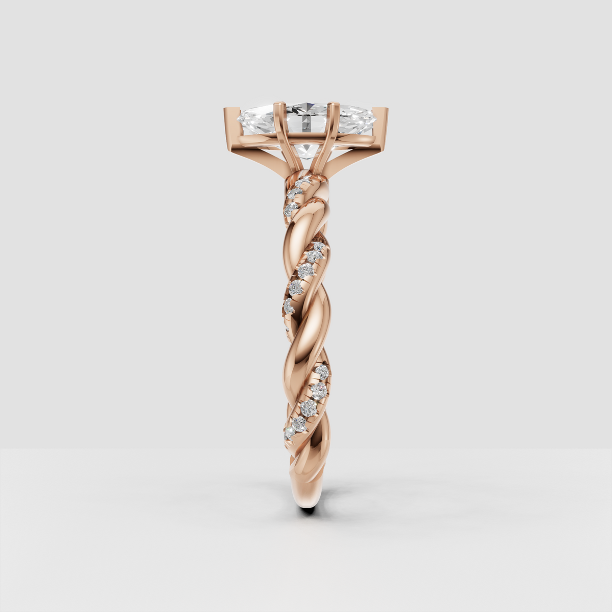 Marquise diamond bridal ring with twisted vine-inspired yellow gold band