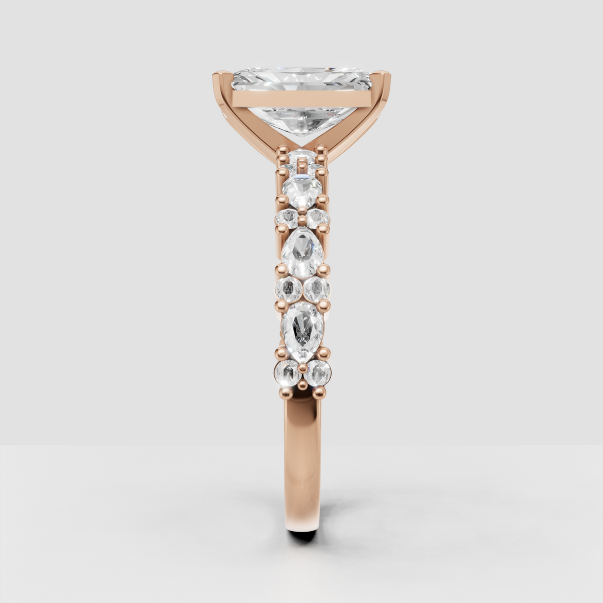 Radiant diamond ring featuring marquise and round accent stones