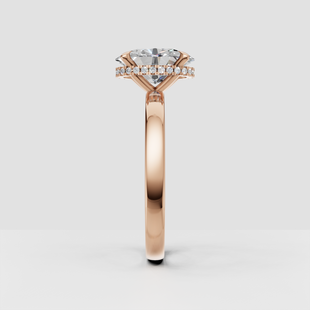 Oval diamond solitaire ring with delicate hidden halo setting