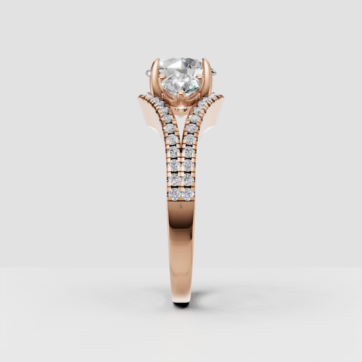Round three stone diamond engagement ring with sparkling shoulders
