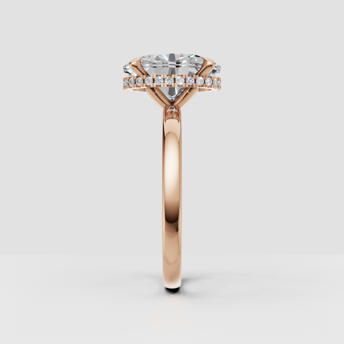 Close-up of oval diamond hidden halo engagement ring