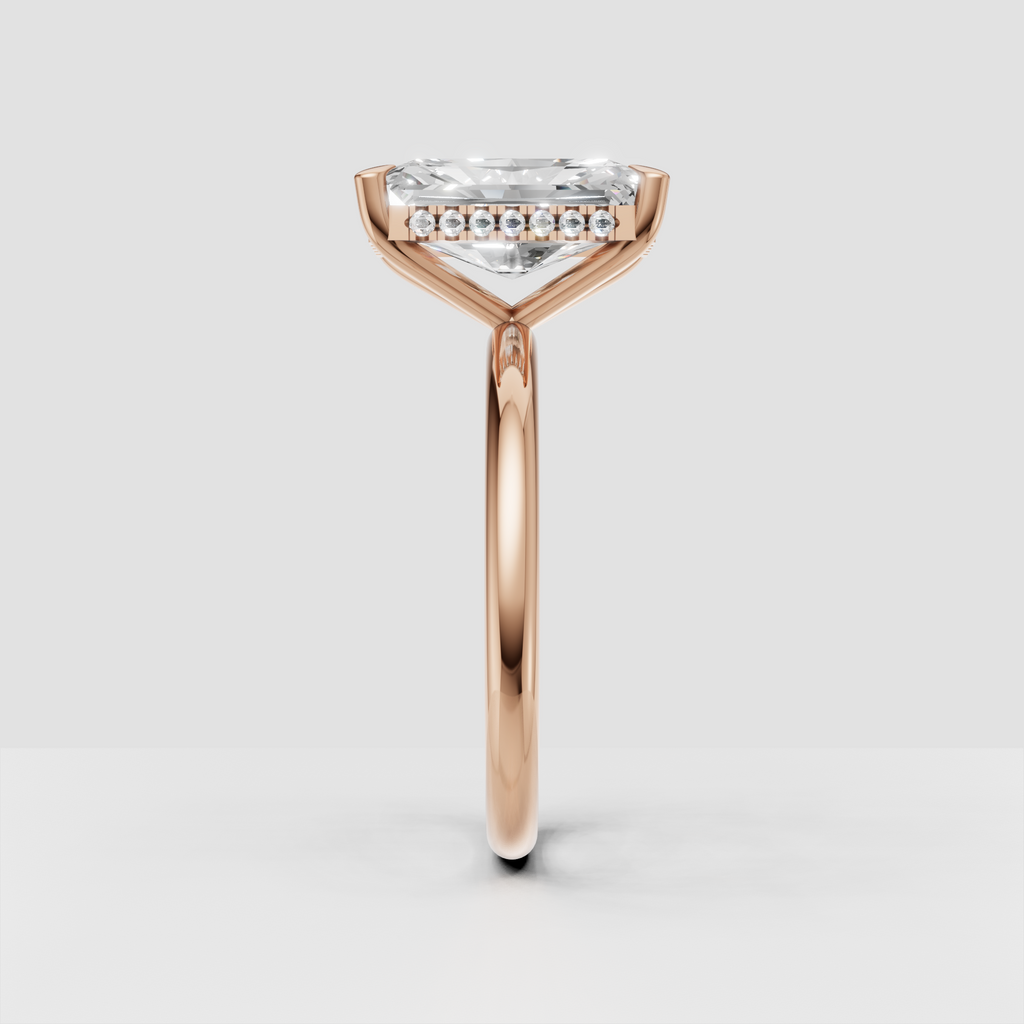 Close-up of radiant cut diamond in yellow gold setting