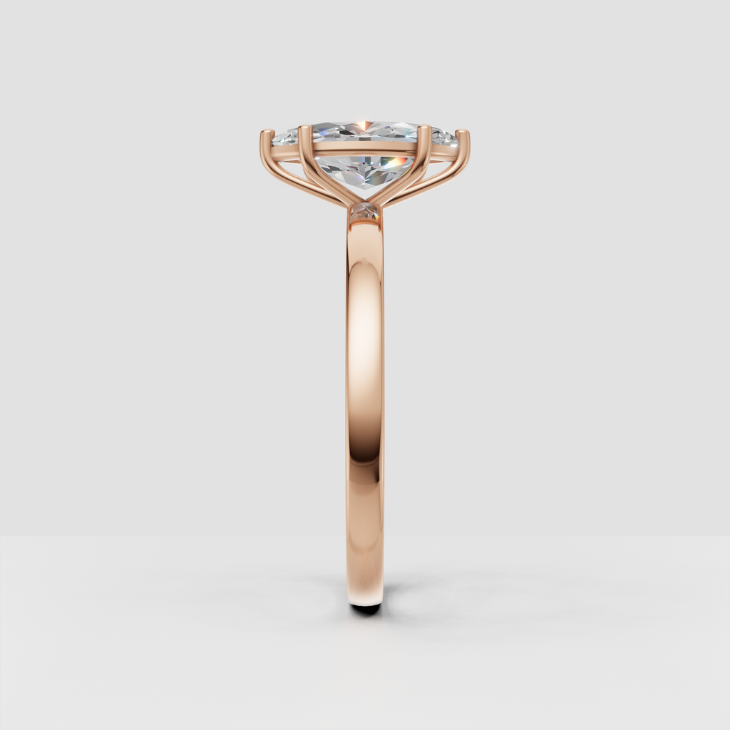Polished yellow gold ring with marquise cut center diamond