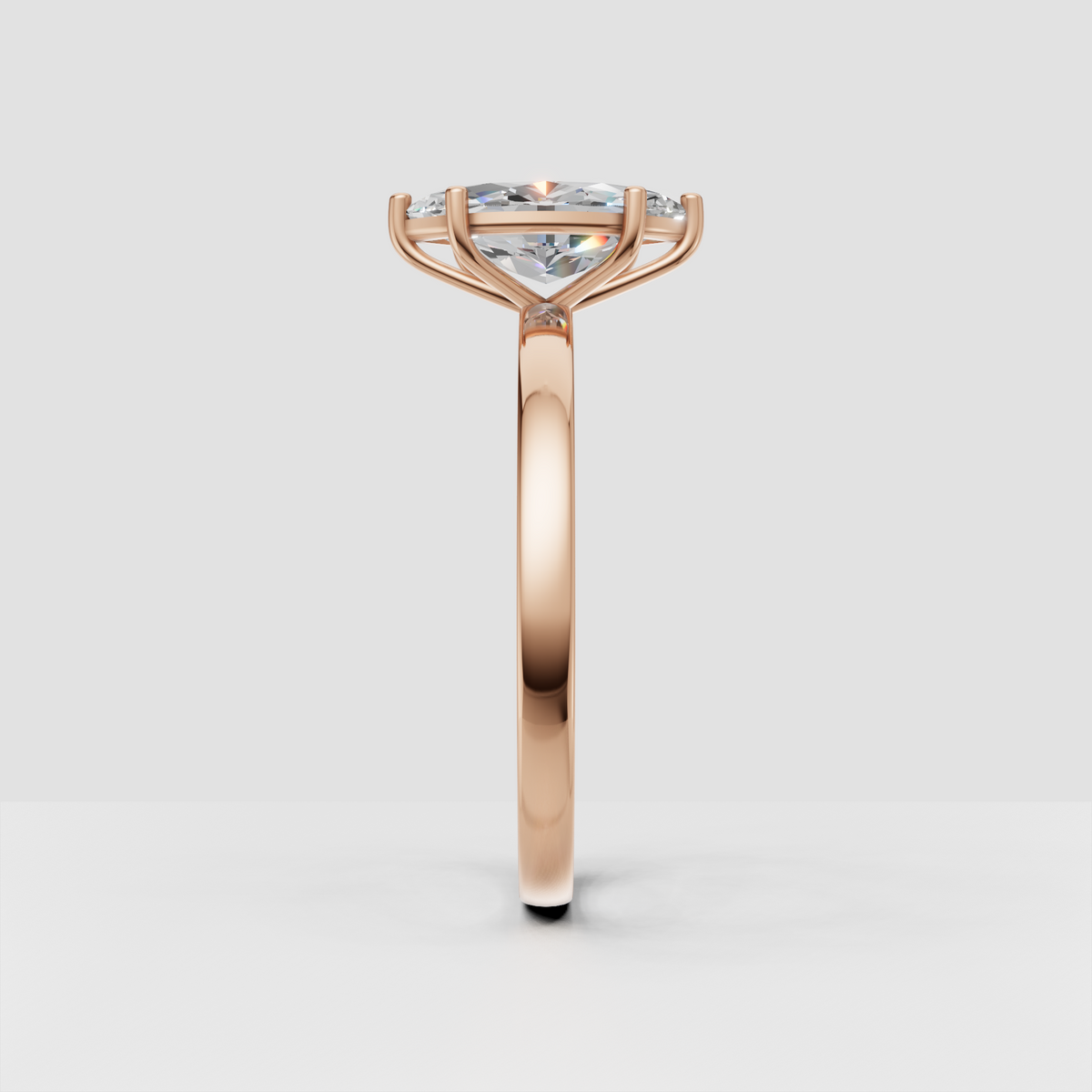 Polished yellow gold ring with marquise cut center diamond