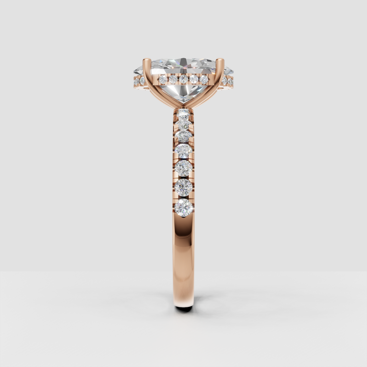 Side view of pear cut diamond engagement ring showing elevated cathedral setting