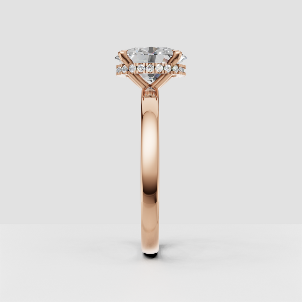 Luxury oval diamond ring with concealed halo of round accent stones