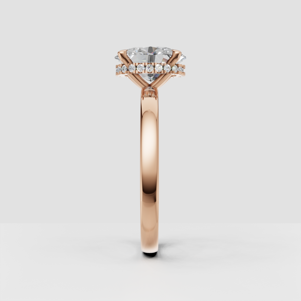 Luxury oval diamond ring with concealed halo of round accent stones