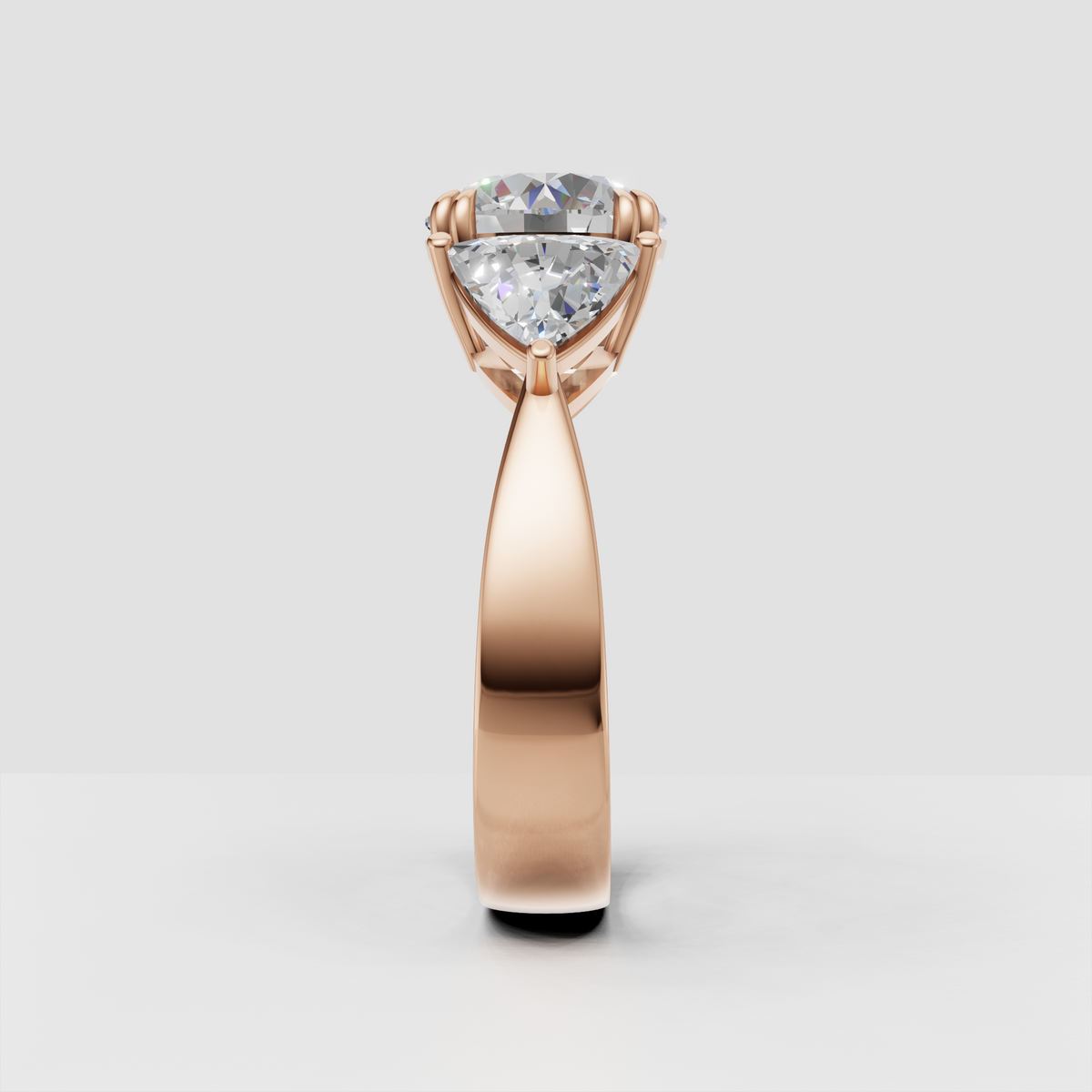 Detailed round diamond three-stone ring with polished gold setting