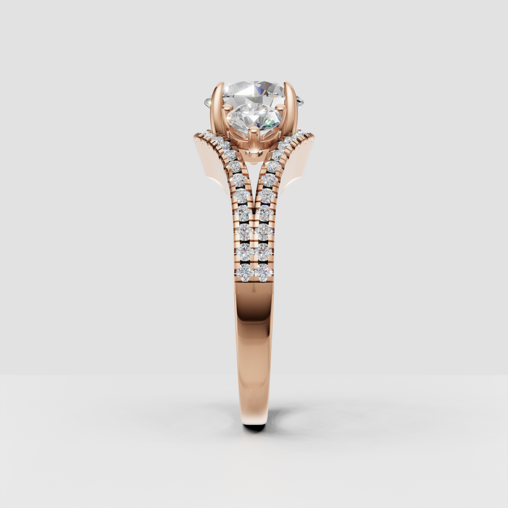 Round diamond ring featuring sculpted four prong setting