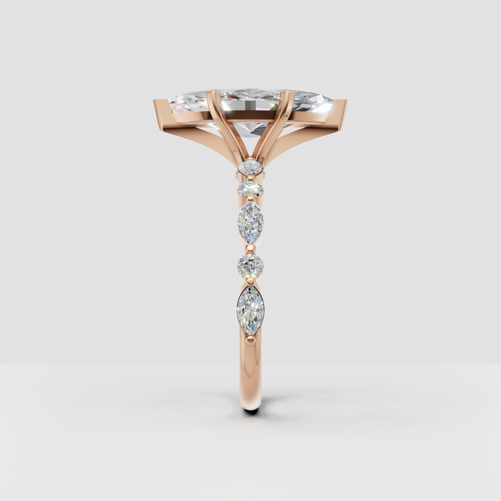 Sparkling marquise diamond engagement ring with alternating side stone design.