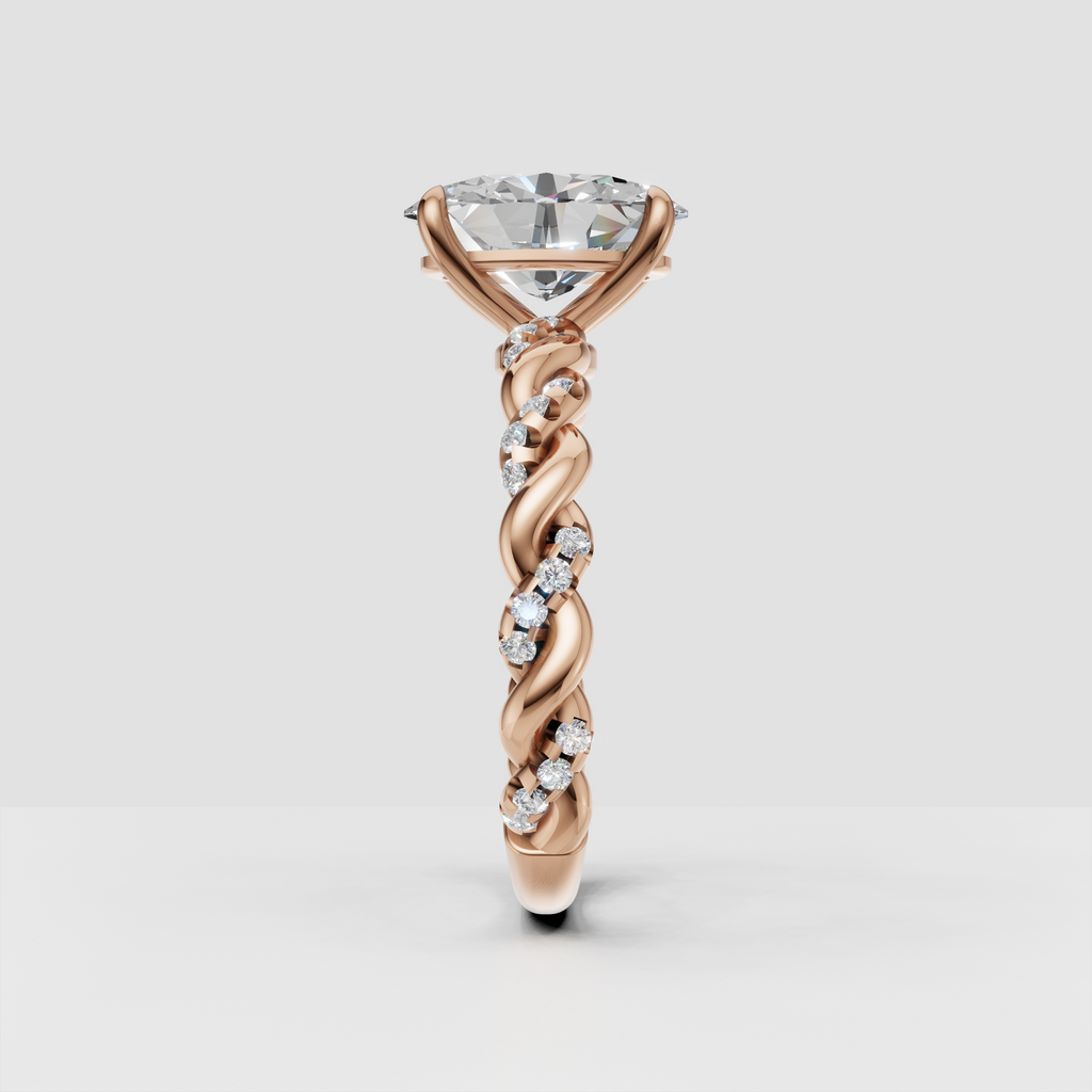 Side view of oval diamond twisted engagement ring in yellow gold