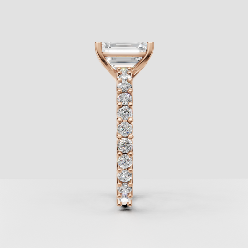 Luxury emerald cut ring with round diamond pave shoulders
