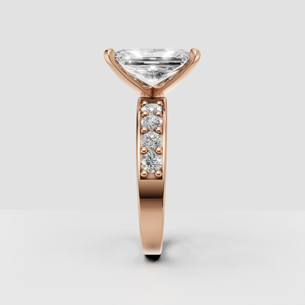 Radiant diamond ring with bead-style accents and round side stones