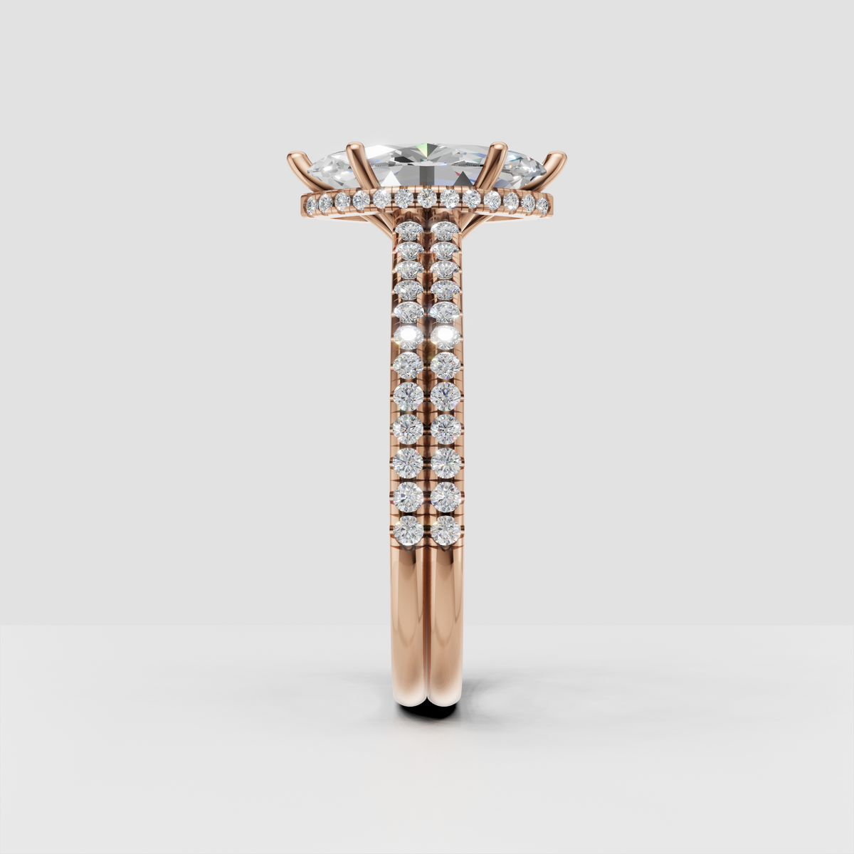 Front view of marquise diamond ring with multi-prong setting and pavé band