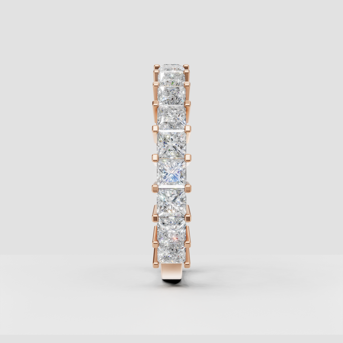 Yellow gold eternity ring featuring cushion cut diamonds