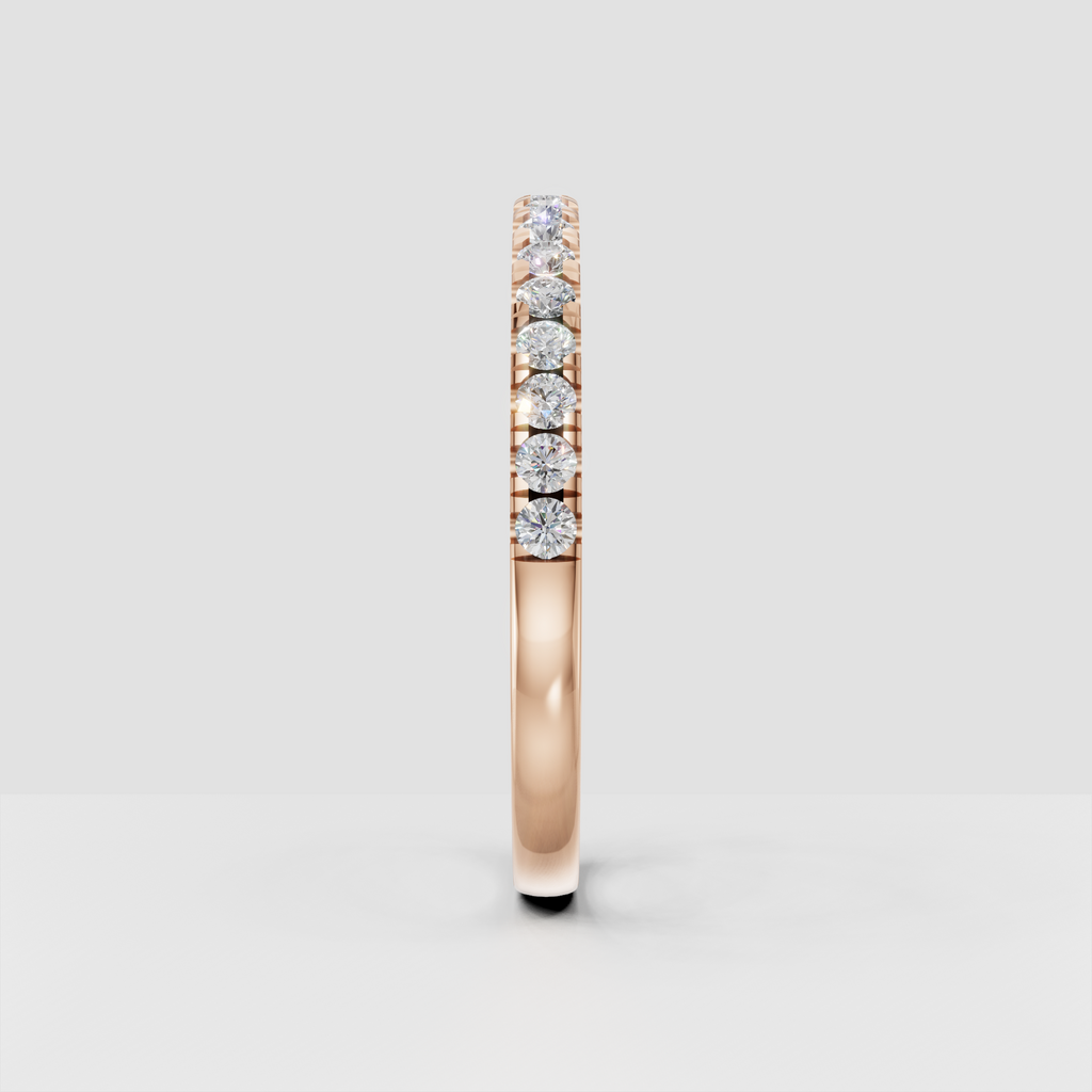 Minimalist round cut diamond wedding band with polished gold finish