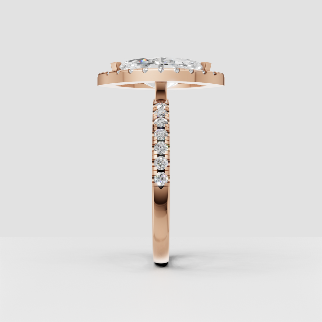 Marquise diamond ring with a halo of round stones and a raised gallery.