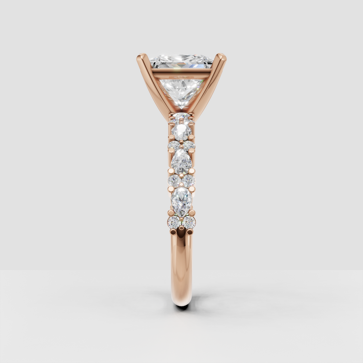 Princess cut diamond ring showing polished yellow gold band and elevated setting