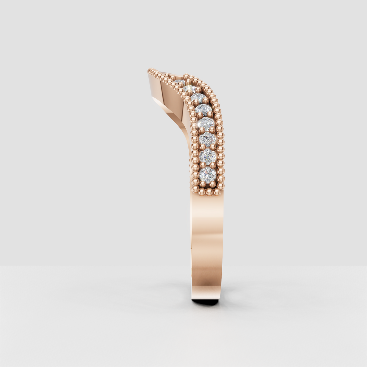 Floral diamond wedding band with raised beaded edges