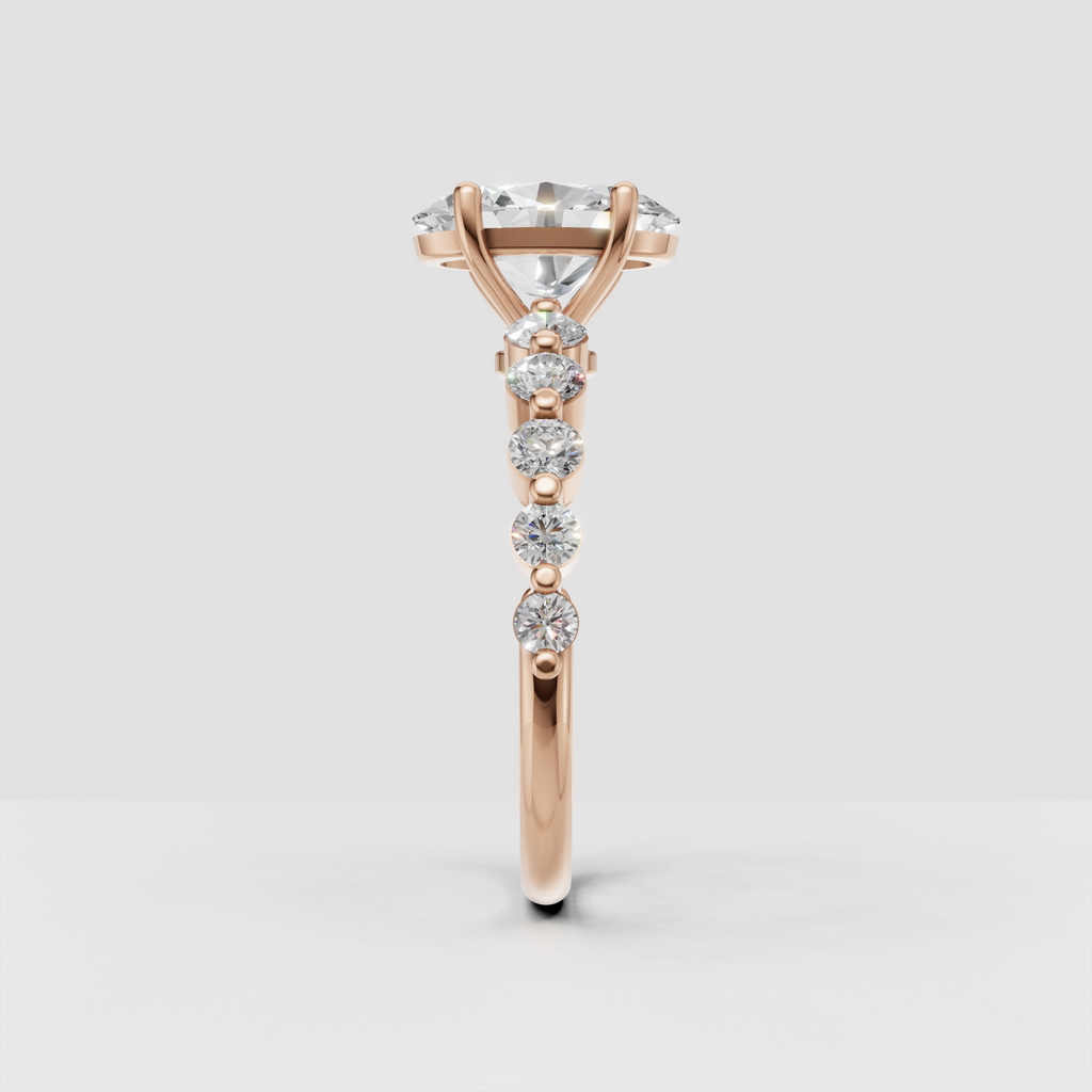 Luxury oval cut diamond ring with round diamonds across the upper shank